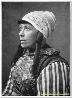 A woman  from Marken Island, North Holland, wearing traditional costume. The elaborate breast plate is called "construction".